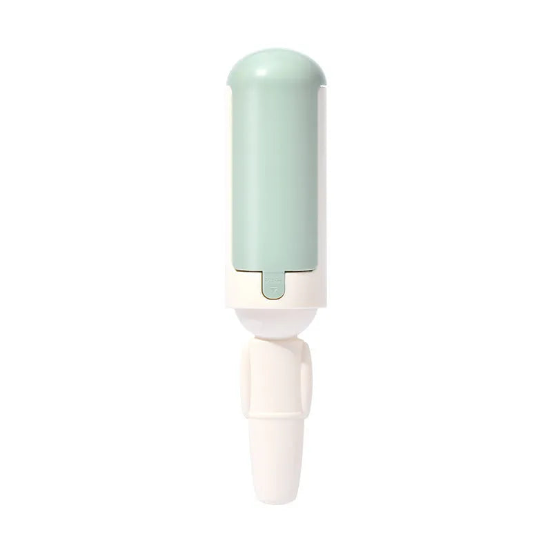 White green reusable pet hair remover roller with non-slip handle on a carpet.
