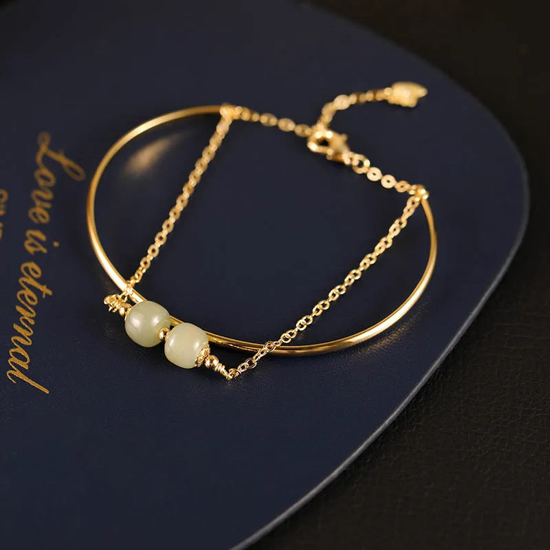 Women's jade lucky beads bracelet with gold inlay design in single, double, and three bead versions