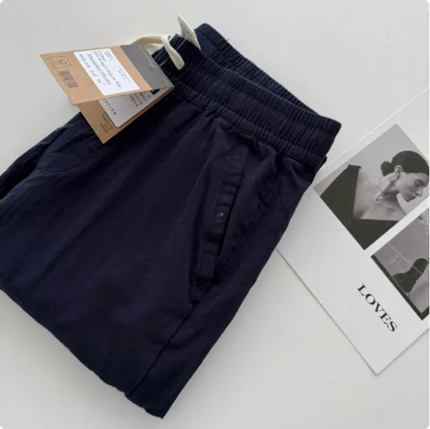 Men's loose fit straight leg casual trousers in beige with a drawstring waistband.