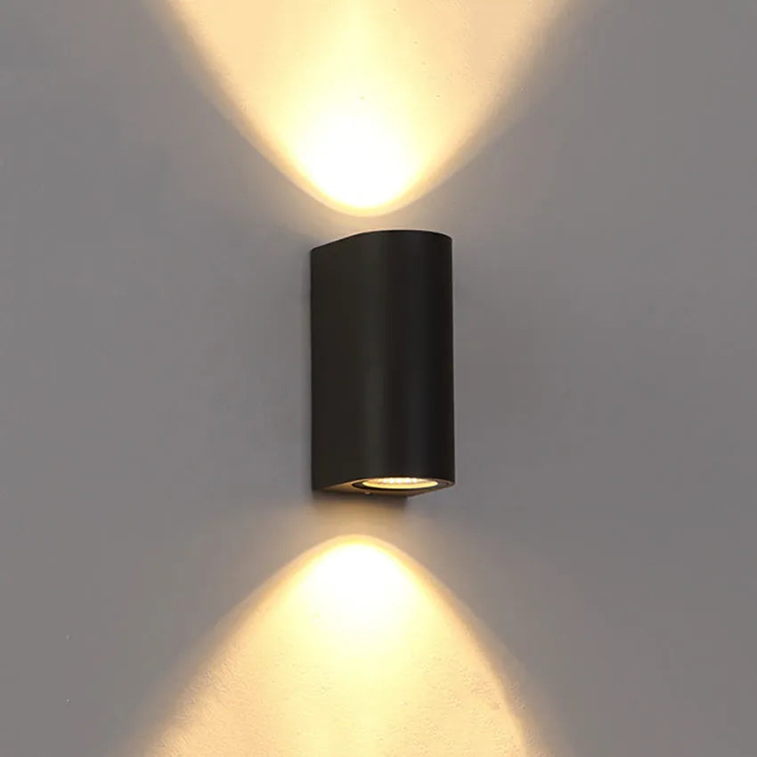 Black aluminium and glass wall-mounted LED lamp with choice of 10W or 12W power.