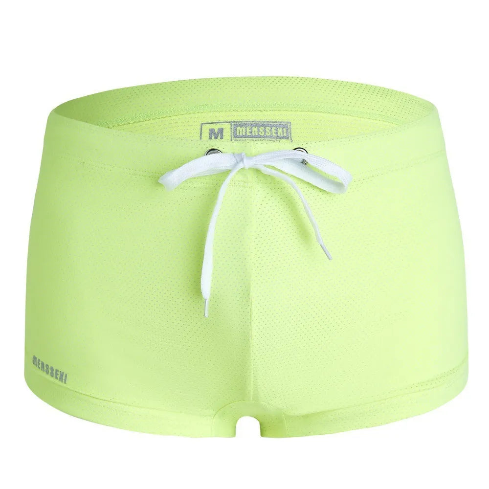 Men's solid colour nylon lace low waist swimming trunks in boxer briefs style.