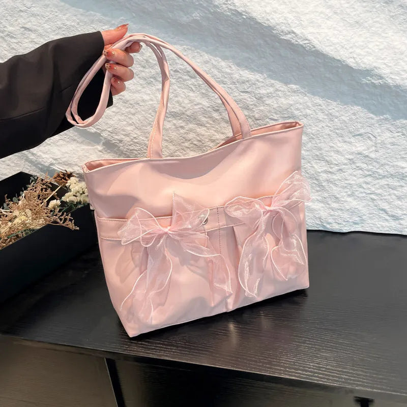 Black and pink college style bow tote bag with large capacity and double shoulder straps.
