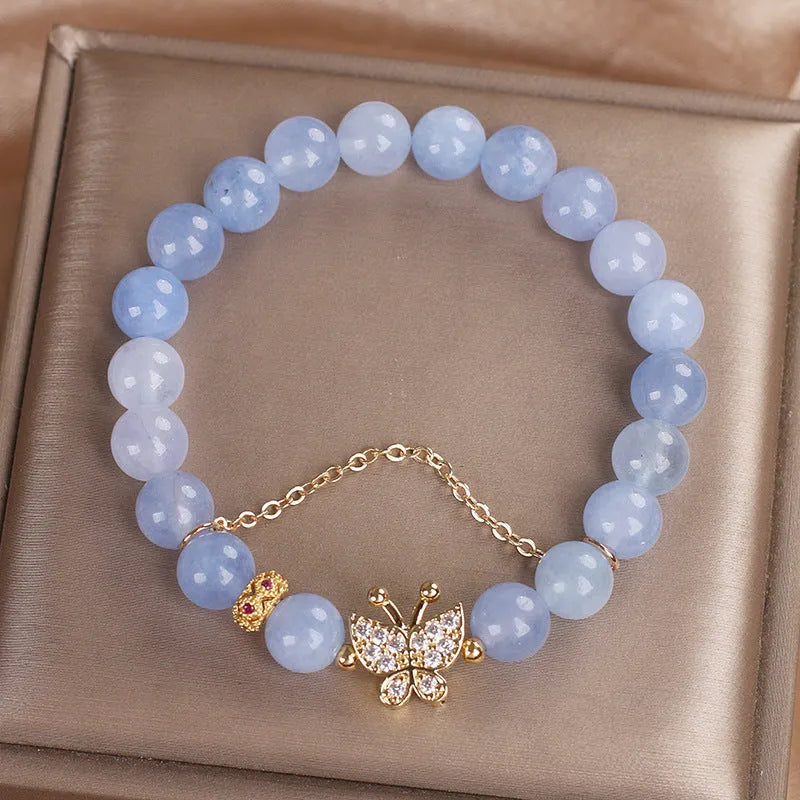Sky blue butterfly crystal bracelet for women with pearls, rhinestones, and sequins on a 17cm chain.