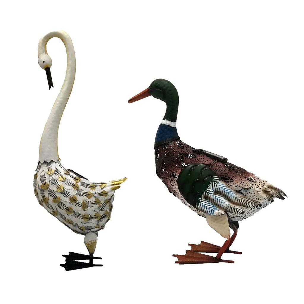Solar powered duck-shaped wrought iron garden light with warm white LED on lawn