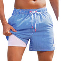 Man wearing loose green boxer-style swimming trunks made from quick-drying spandex fabric.