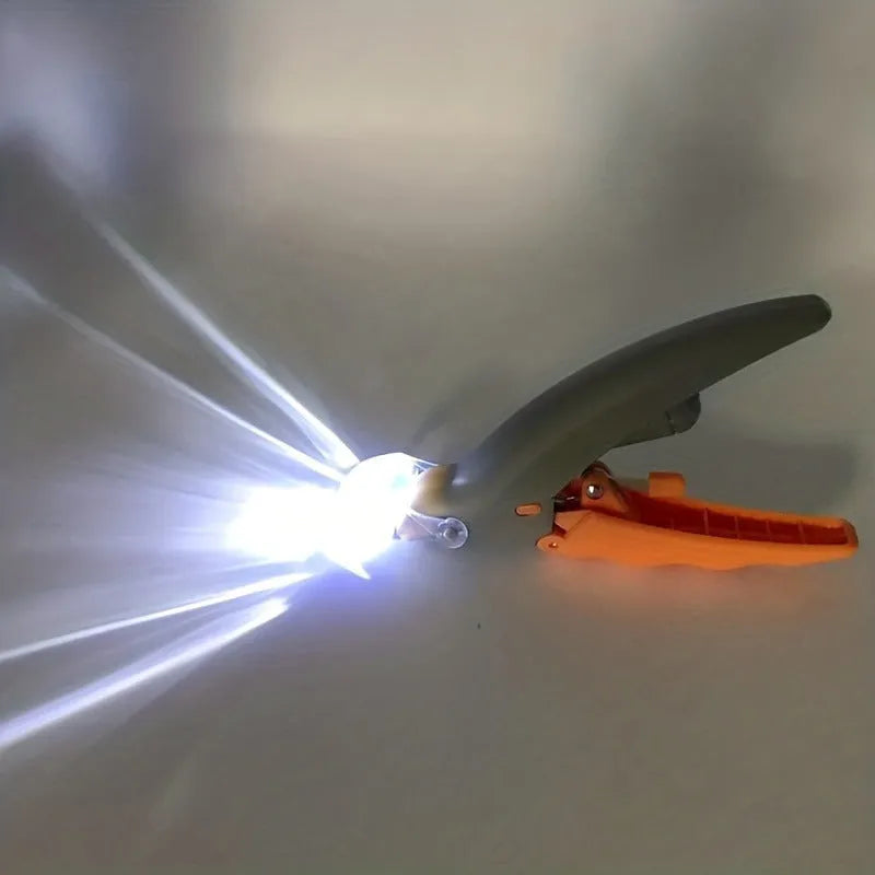 Yellow LED pet nail trimmer with magnifying glass, showing steel blades and on/off switch.