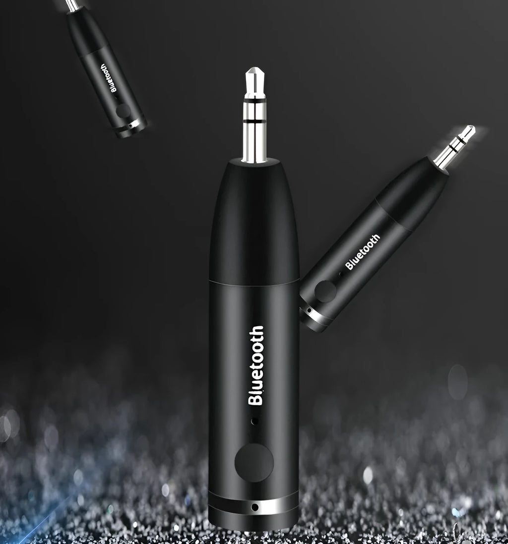 Black Bluetooth 5.0 audio receiver for car AUX or home stereo, shown with USB cable.