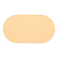 Green silicone cat feeding mat with raised edge under a ceramic bowl on a wooden floor