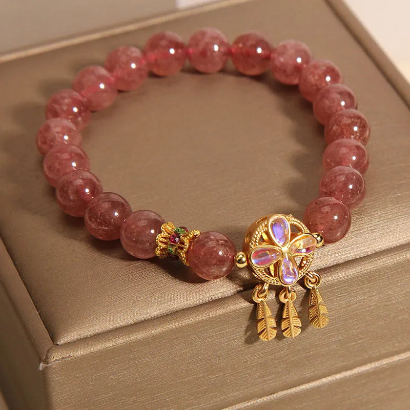 Women's strawberry quartz bracelet with dream catcher pendant and four-leaf clover charm in natural pink crystal