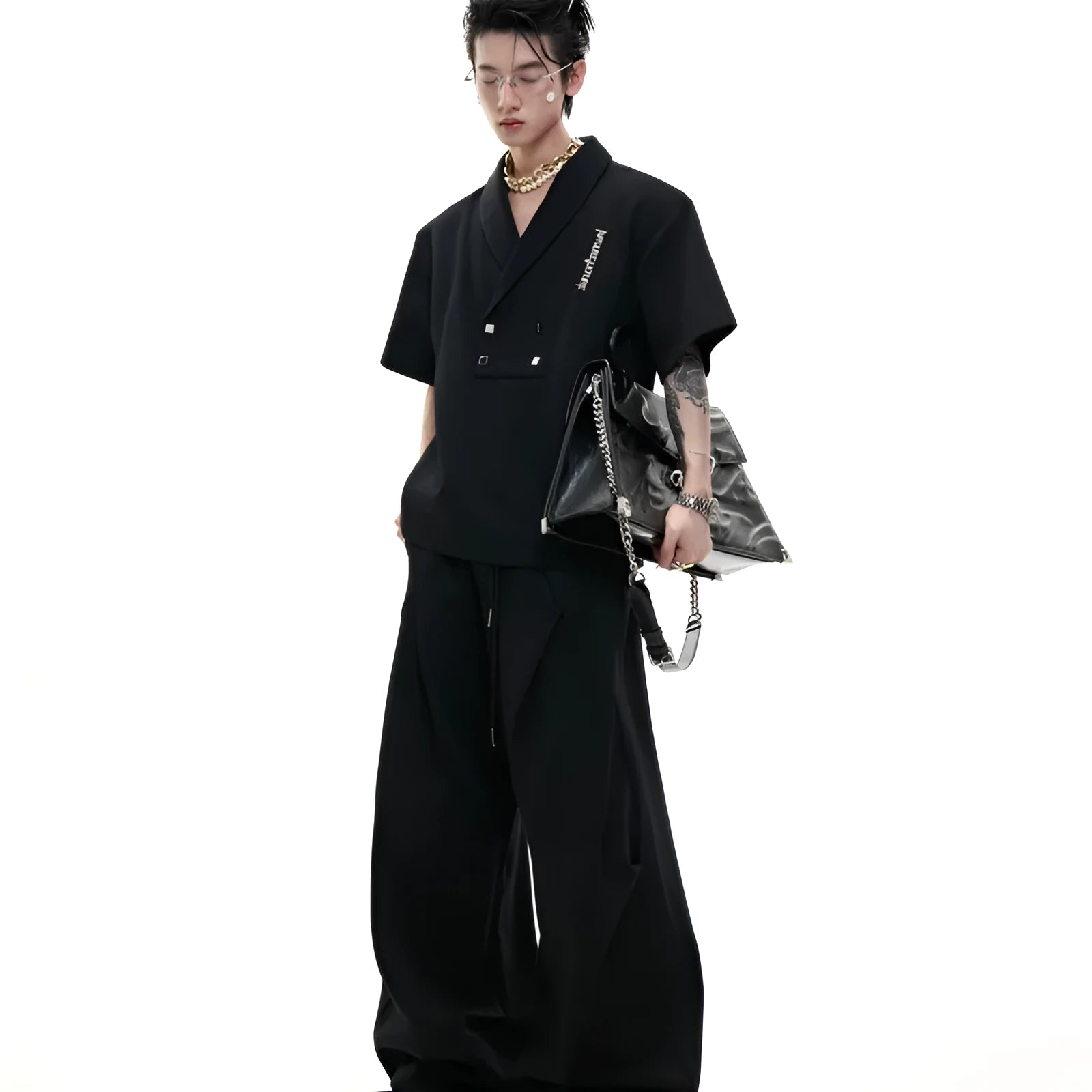Men's dark grey cotton sports suit with padded shoulders, featuring a V-neck short-sleeve shirt and matching shorts.
