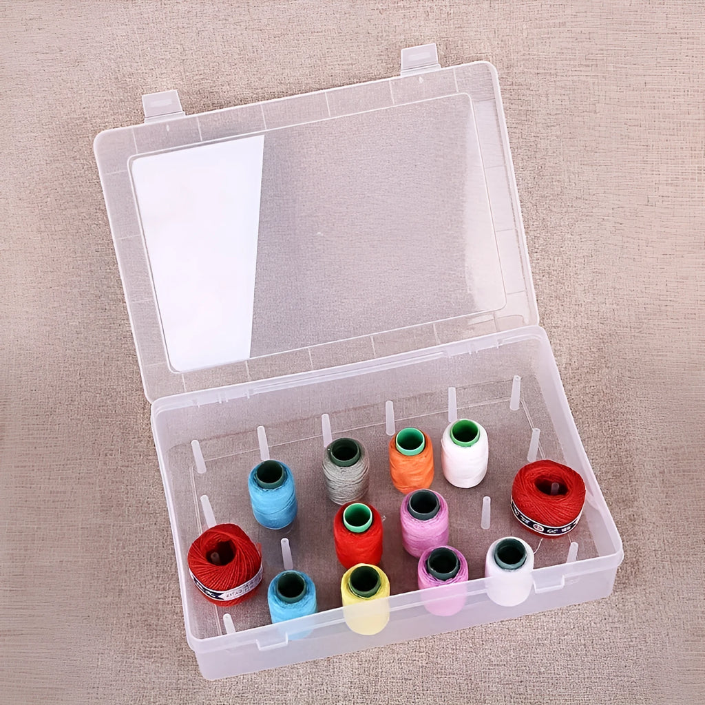 Plastic storage box with 42 compartments for organising embroidery threads and sewing kit items.