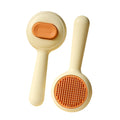 Stainless steel cat grooming brush with non-slip plastic handle in green colour