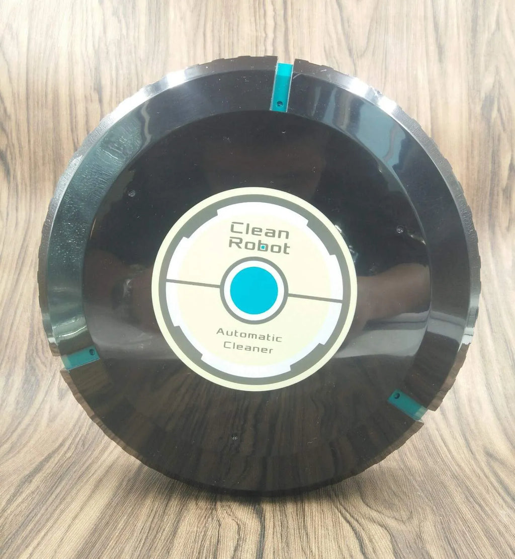Black and white compact AC automatic sweeping robot vacuum cleaner on a wooden floor.