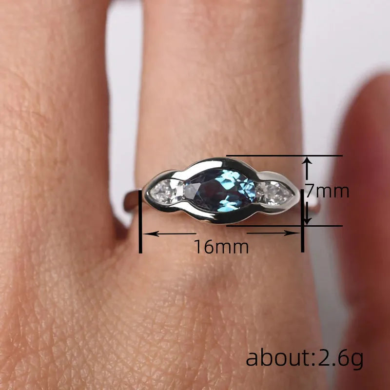 Women's geometric ellipse ring with zircon stones in white gold colour on copper band