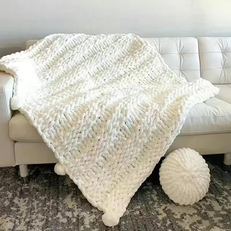 Coarse yarn chenille knitted blanket with braided gravity detail in modern colour option