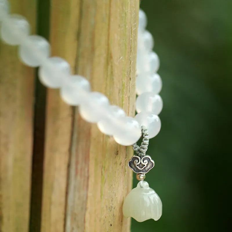 S925 silver and white agate Hetian jade lotus bracelet with geometric national style design