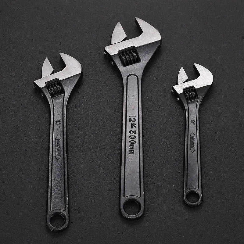 15-inch stainless steel adjustable open-end wrench with a blackened head and ergonomic handle.