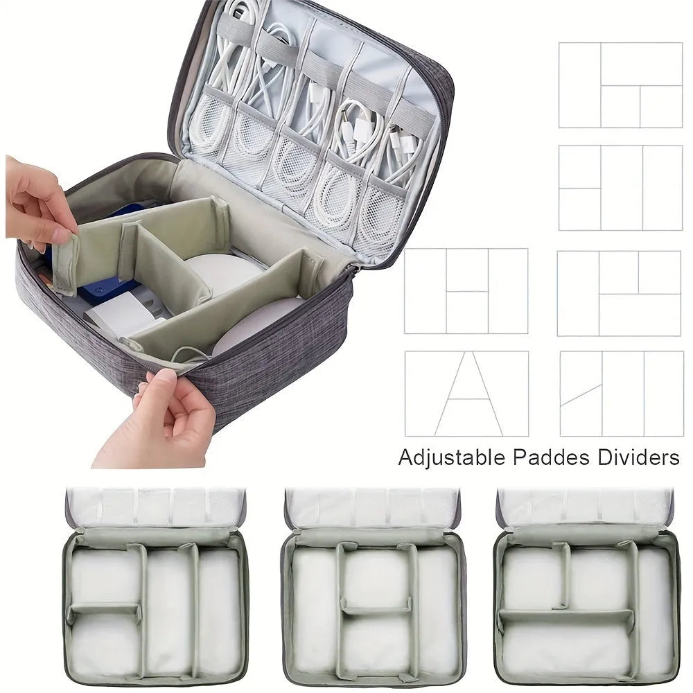 Black waterproof electronics organiser bag open, showing mesh pockets, elastic loops, and removable padded dividers inside.
