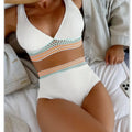 Women's high waist solid colour bikini set in white or pink, made from nylon fabric.