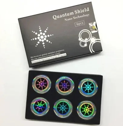 Six anti-radiation mobile phone stickers in gold and silver colours with negative ion energy
