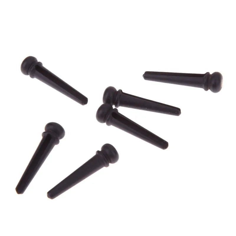 Six ebony folk guitar string nails with 5.3mm bayonet diameter in matt black finish