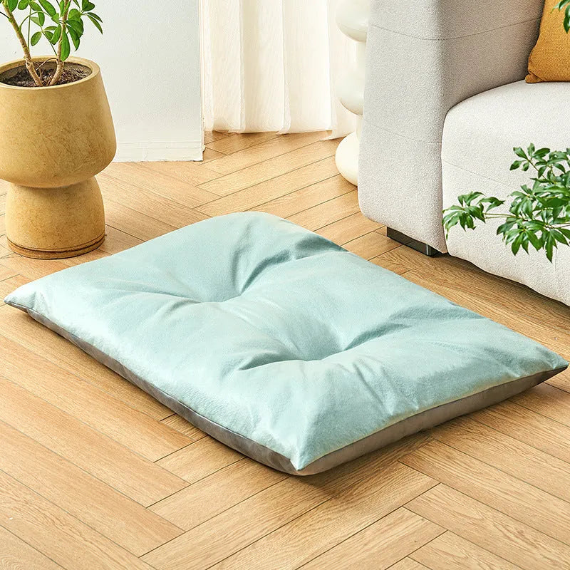 Blue and coffee coloured cool summer pet sleeping mat for cats and dogs shown in four different sizes.
