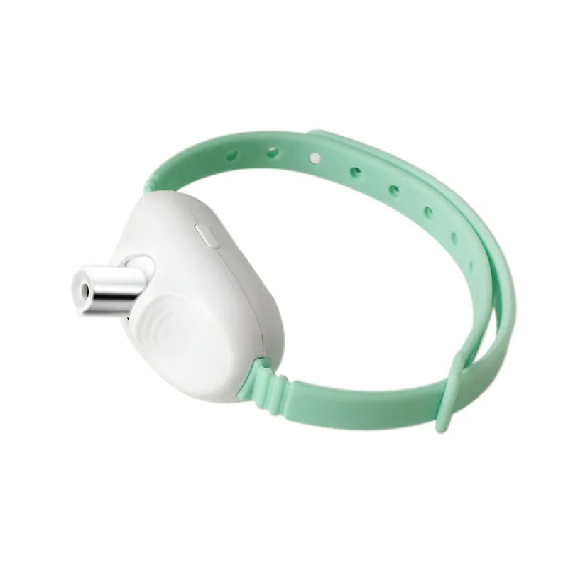 USB rechargeable interactive laser cat teasing collar in green and pink colours on an adjustable nylon strap