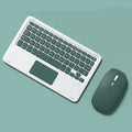 Pink Bluetooth touch keyboard and mute wireless mouse combo with USB charging cable on white background