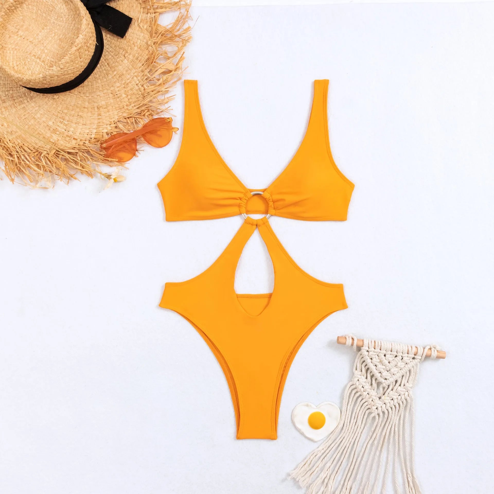 Women's black triangle one-piece sleeveless swimsuit made of nylon on a size chart.