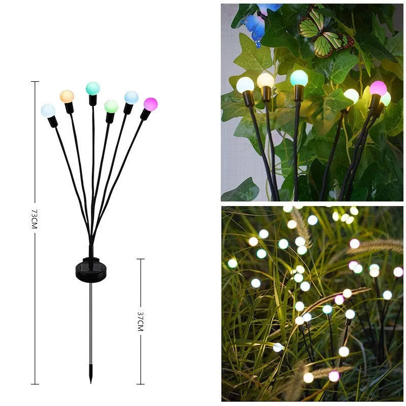 Solar-powered LED firefly garden spike light with multiple heads and a press-in ground plug on grass.