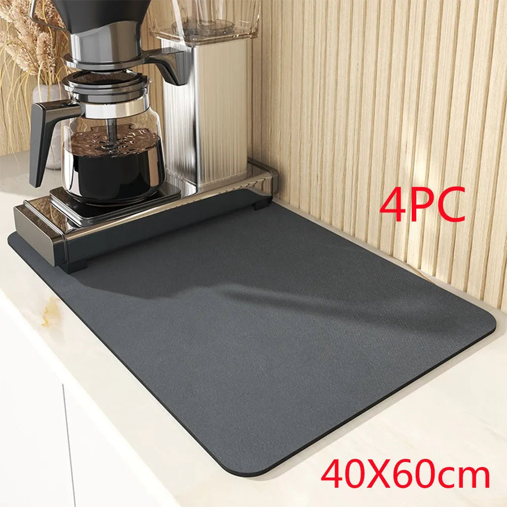 Black square kitchen drain drying mat with anti-slip rubber backing on a countertop