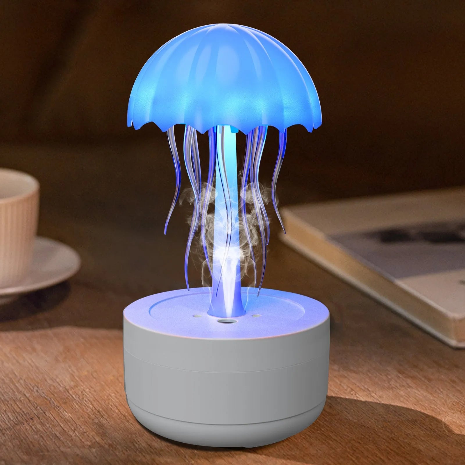 White jellyfish design humidifier diffuser with colourful night lights on desk