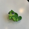 Dinosaur acrylic jaw hair grip clip showing colourful little dinosaur designs on clear background