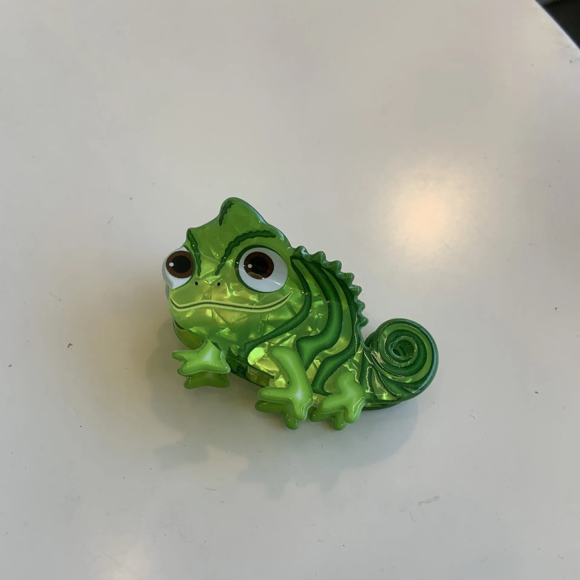 Dinosaur acrylic jaw hair grip clip showing colourful little dinosaur designs on clear background