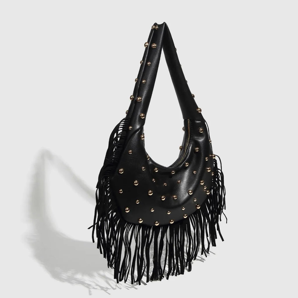 Retro black shoulder handbag with a gold tassel detail and structured shape.