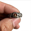 Hand-forged copper grotto Buddha ring with a rock texture finish, shown in size 8.