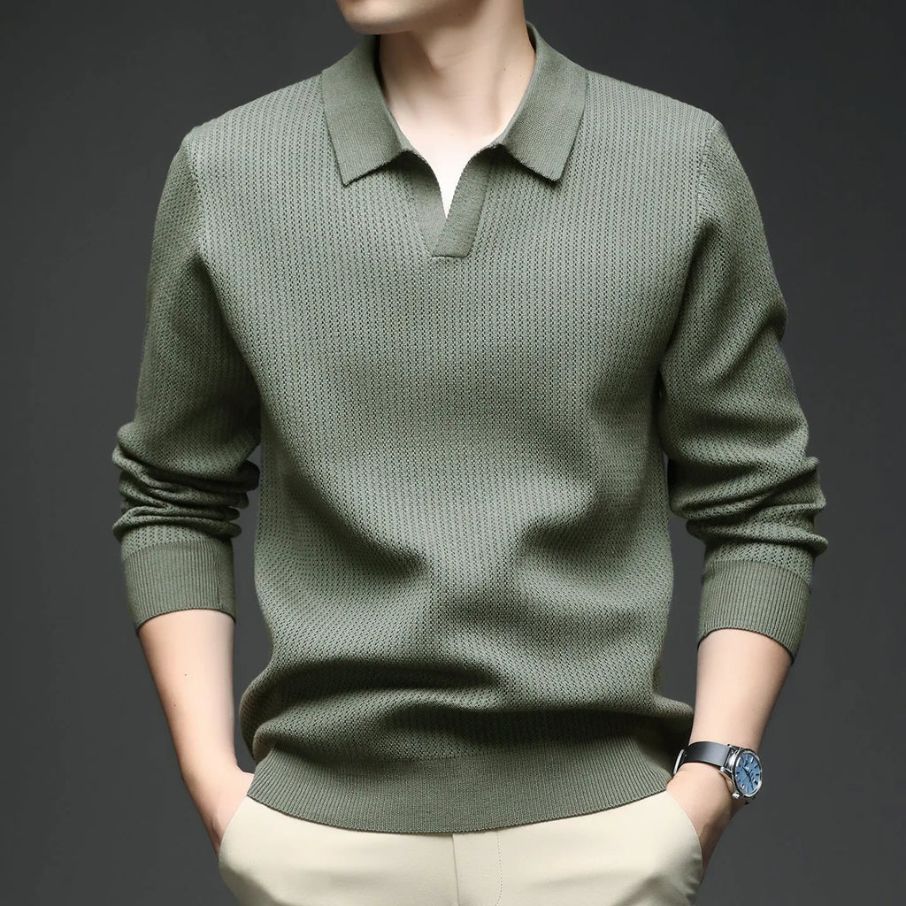 Man wearing a loose fit camel coloured casual pullover sweater.
