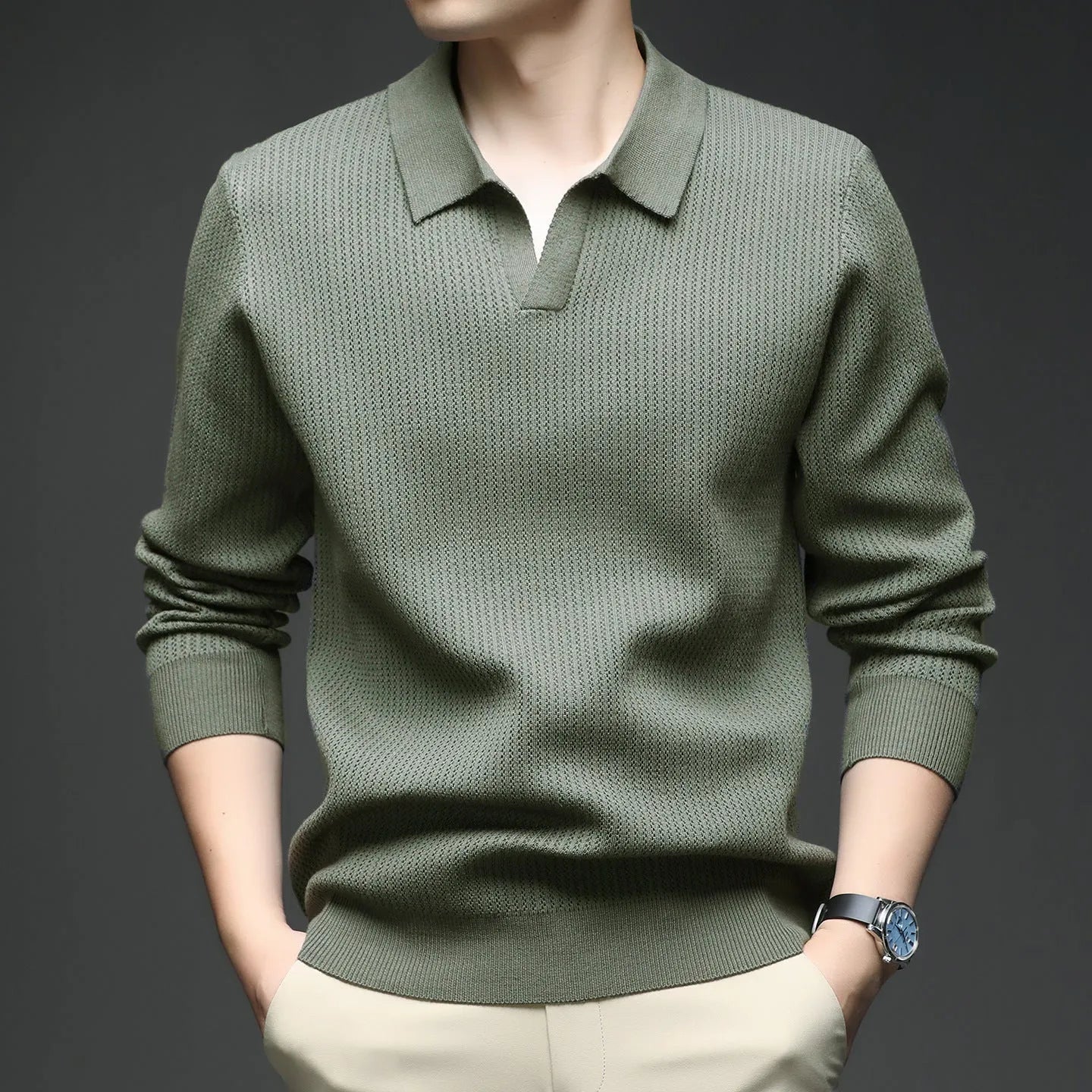 Man wearing a loose fit camel coloured casual pullover sweater.