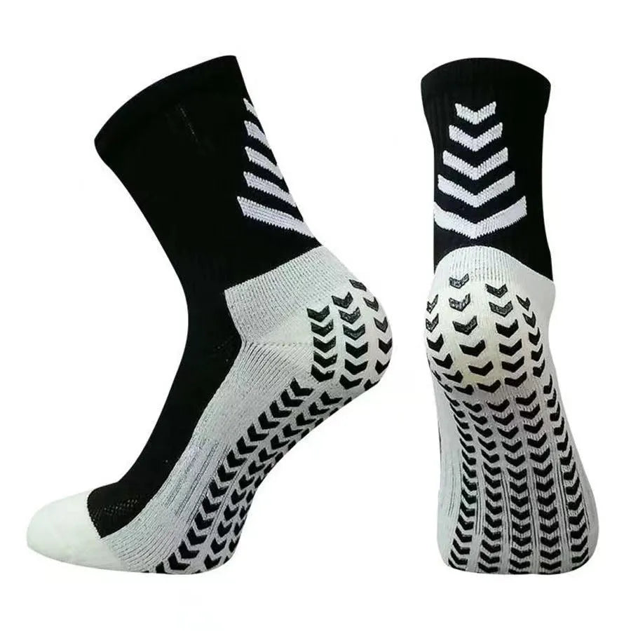 Men's black and green mid-calf athletic socks with a geometric pattern and non-slip silicone grip.