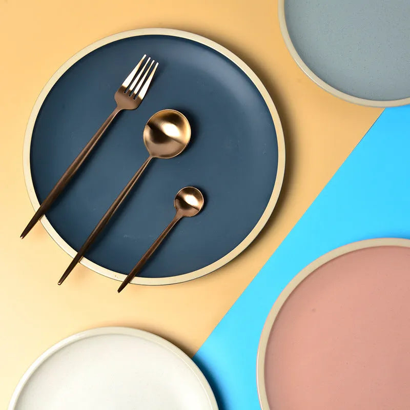 10-inch pure blue matte finish ceramic dinner plate on a table.