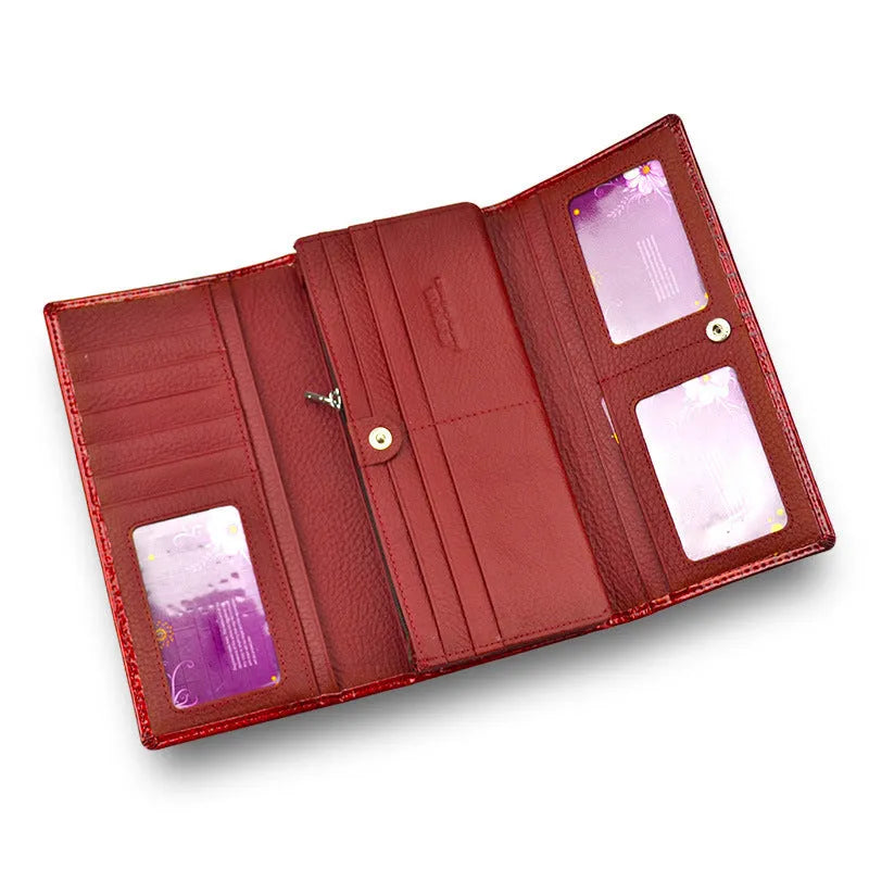 Red women's leather coin purse with a crocodile pattern texture and pigskin lining.