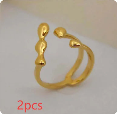 Brass spherical ring for women in gold or silver colour on a circular band.