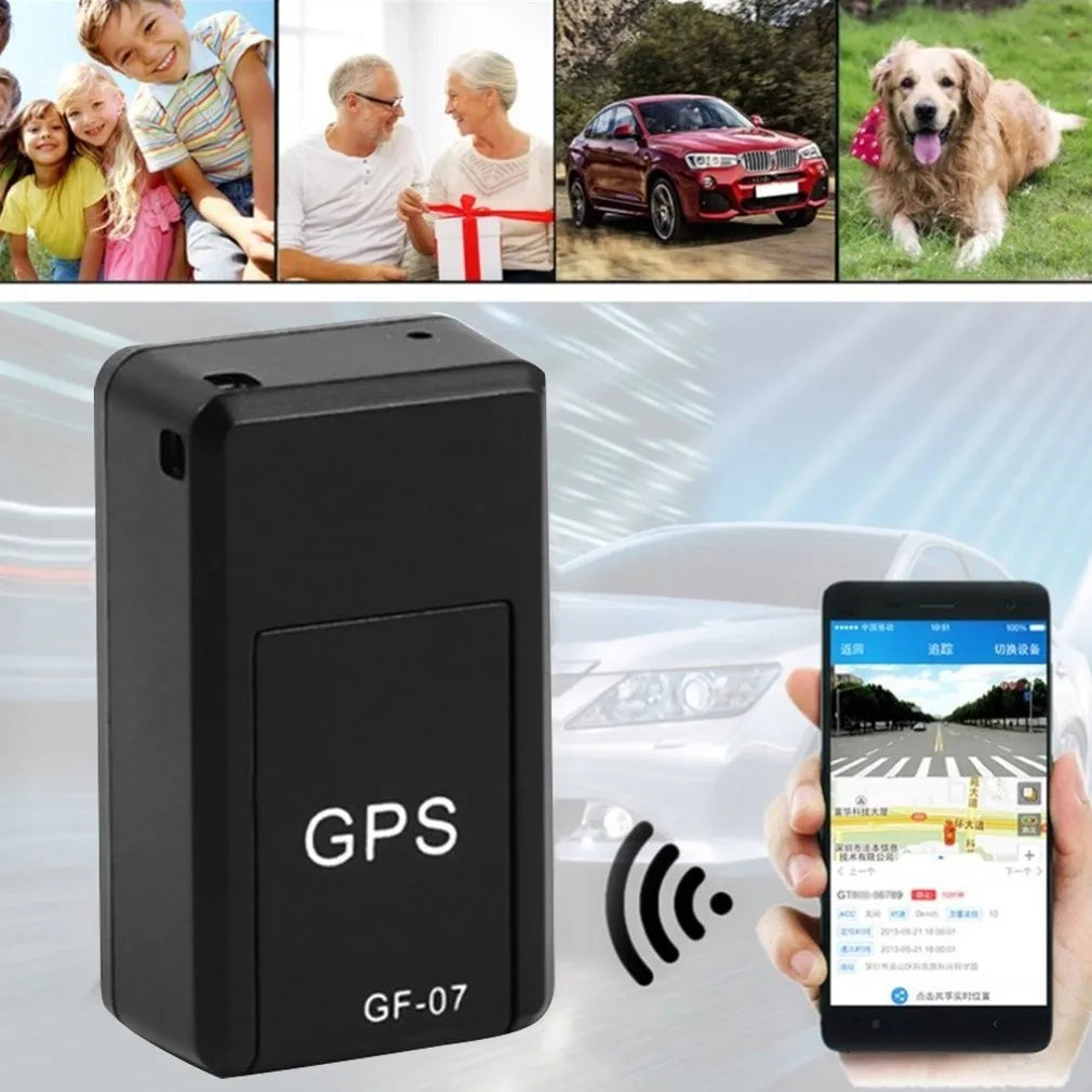 Small black magnetic GPS tracker device next to a USB charging cable on a table.