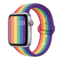 Black silicone sports wristband with a single buckle, shown alongside rainbow and white colour options.