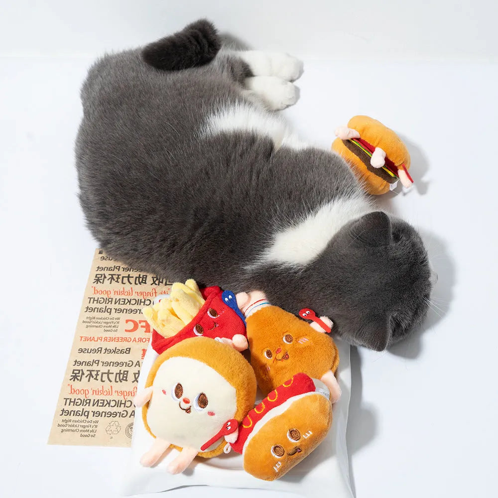 Cat chewing toy shaped like hamburger and chicken leg with catnip filling