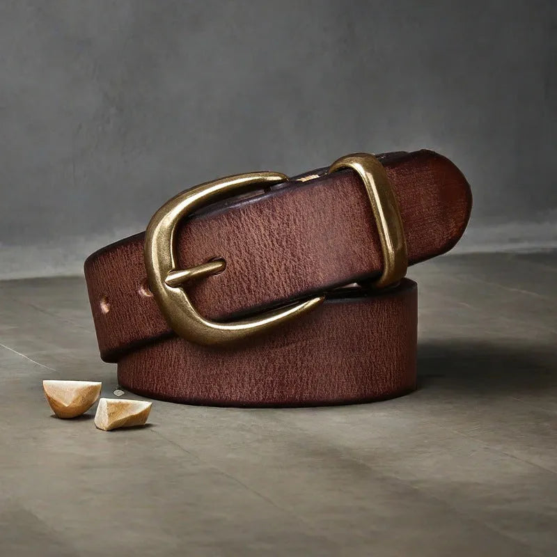 Men's brown casual leather belt with a copper pin buckle shown on a pair of jeans