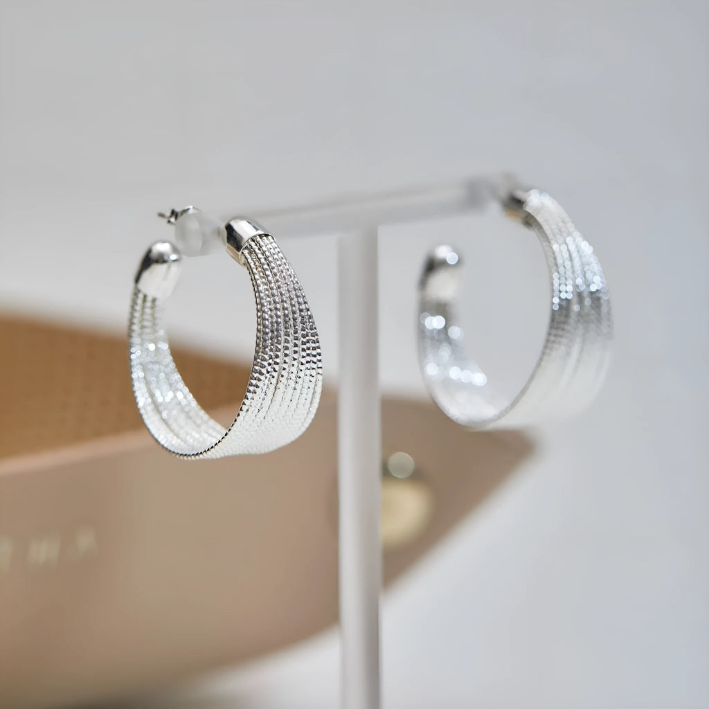 Copper geometric multi-layer bracelet earrings with electroplated silver and gold finish showing stud and clip pieces