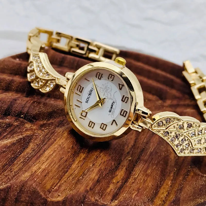 Women's stainless steel watch with round dial, available in gold, golden white, or golden black surface options