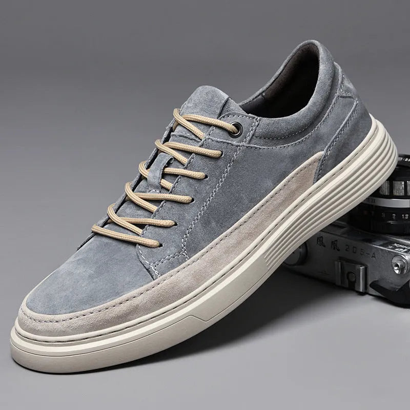 Men's grey casual leather skate shoes with low-top design and round toe on a rubber sole.