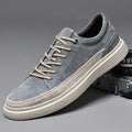 Men's grey casual leather skate shoes with low-top design and round toe on a rubber sole.